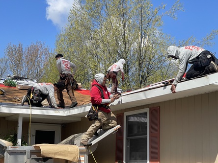 Roofman crew working on a modern home located in Adrian MI