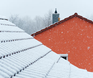 Red roof with snow on it.